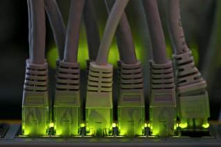 LAN network cables plugged into a Bitcoin mining computer server are pictured in Bitminer Factory in Florence, Italy, April 6, 2018. Picture taken April 6, 2018. REUTERS/Alessandro Bianchi