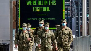 U.S. military personnel wearing face masks arrive at the Jacob K. Javits Convention Center, as the outbreak of the coronavirus disease (COVID-19) continues, in the Manhattan borough of New York City, New York, U.S., April 7, 2020. REUTERS/Eduardo Munoz TP