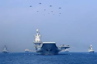 Warships and fighter jets of Chinese People's Liberation Army (PLA) Navy take part in a military display in the South China Sea April 12, 2018. Picture taken April 12, 2018. REUTERS/Stringer 