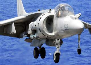 U.S. Marine Corps Maj. M. J. Shulte lands an AV-8B Harrier aircraft on the flight deck of the amphibious assault ship USS Peleliu (LHA 5), while under way in the Pacific Ocean.