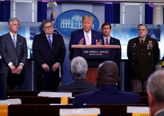 U.S. President Donald Trump addresses the daily coronavirus response briefing as National Security Advisor Robert O'Brien, Attorney General William Barr, Defense Secretary Mark Esper and U.S. Joint Chiefs Chairman Gen. Mark Milley listen at the White Hous