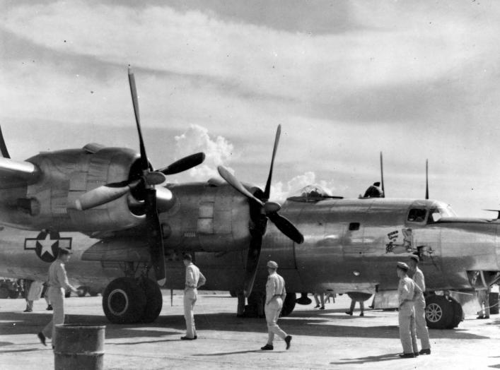 AAF personnel at Clark Field, Philippines, get their first look at a Consolidated B-32 Dominator in May 1945. Comparable to the B-29 in size and performance, B-32s saw service with only one bomber squadron before war's end. (U.S. Air Force photo)