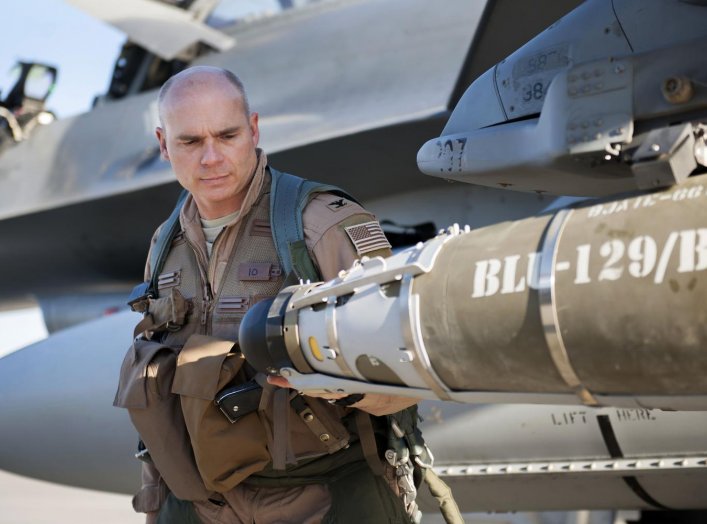 U.S. Air Force Col. Henry Rogers, 421st Expeditionary Fighter Squadron, conducts pre-flight inspections on an F-16 Fighting Falcon aircraft at Bagram Airfield, Afghanistan, Nov. 27, 2015. U.S. Air Force photo by Tech. Sgt. Robert Cloys