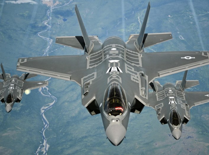 F-35A Lightning II aircraft receive fuel from a KC-10 Extender from Travis Air Force Base, Calif., July 13, 2015, during a flight from England to the U.S.