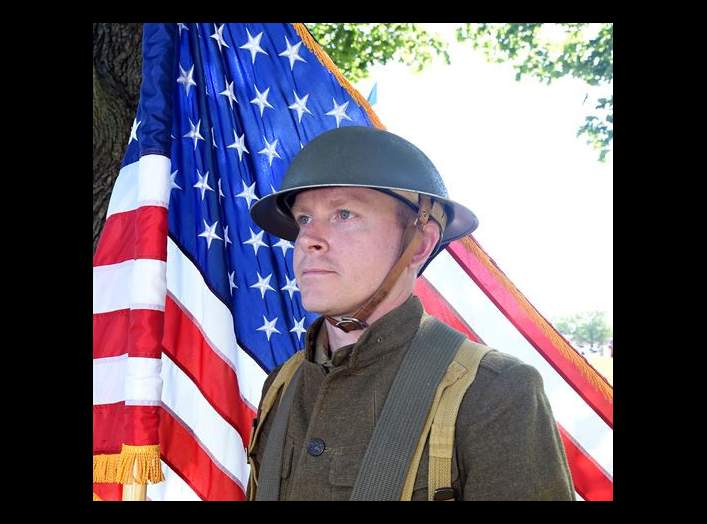 Army Reserve Staff Sgt. Walter Rodgers, Human Resources Sergeant, 85th Support Command, holds the American flag during the centennial anniversary of the 85th Support Command on June 9, 2017 at Arlington Heights, Illinois.