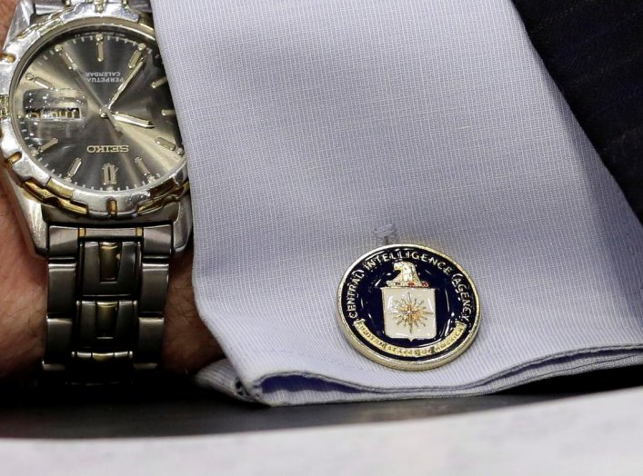 An cufflink with CIA logo is seen on CIA Director John Brennan's shirt as he testifies before the Senate Intelligence Committee hearing on "diverse mission requirements in support of our National Security", in Washington, U.S., June 16, 2016. REUTERS/Yuri