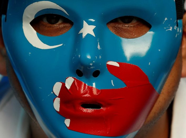 A Chinese Uyghur Muslim participates in an anti-China protest during the G20 leaders summit in Osaka, Japan June 28, 2019. REUTERS/Jorge Silva