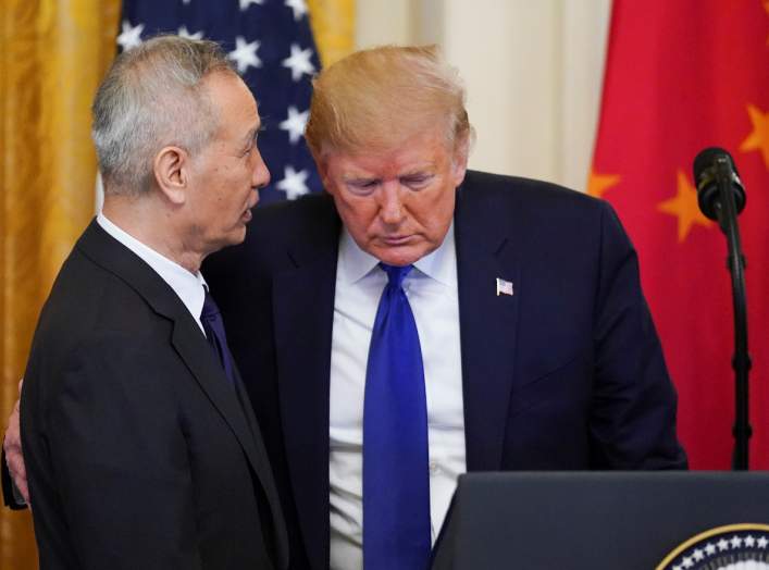 Chinese Vice Premier Liu He talks with U.S. President Donald Trump during a signing ceremony for "phase one" of the U.S.-China trade agreement in the East Room of the White House in Washington, U.S., January 15, 2020. REUTERS/Kevin Lamarque