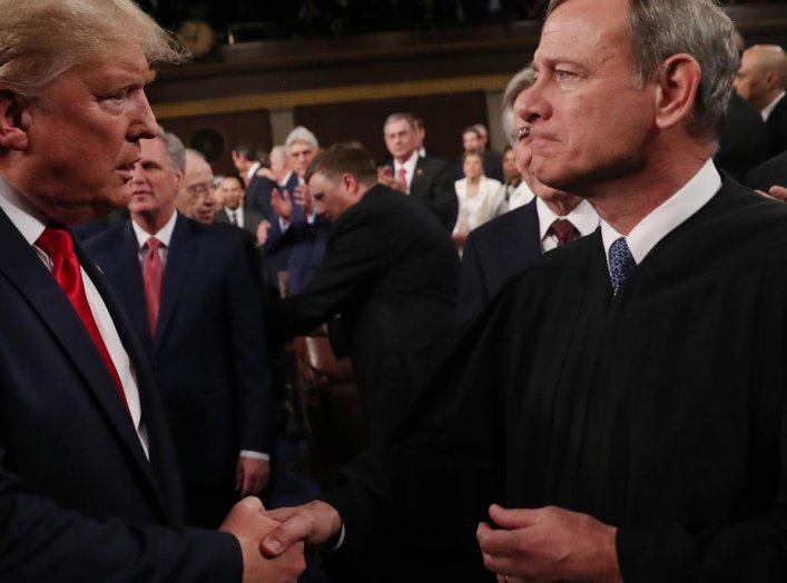 U.S. President Donald Trump greets Supreme Court Chief Justice John Roberts as he arrives to deliver his State of the Union address to a joint session of the U.S. Congress in the House Chamber of the U.S. Capitol in Washington, U.S. February 4, 2020. REUT