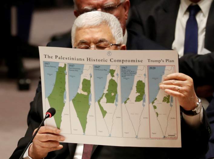 Palestinian President Mahmoud Abbas holds a document while speaking during a Security Council meeting at the United Nations in New York, U.S., February 11, 2020. REUTERS/Shannon Stapleton