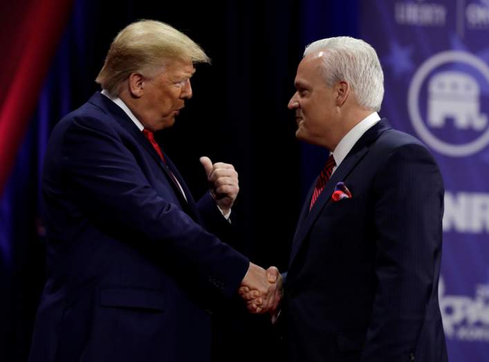 U.S. President Donald Trump (L) shakes hands with Matt Schlapp, chairman of the American Conservative Union, at the Conservative Political Action Conference (CPAC) annual meeting at National Harbor in Oxon Hill, Maryland, U.S., February 29, 2020. REUTERS/
