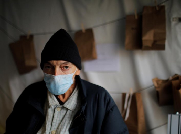 Kevin Keeley, who has been homeless for eight months and may have come in contact with someone with coronavirus disease (COVID-19), poses for a portrait outside a quarantine tent run by Boston Health Care for the Homeless in Boston, Massachusetts, U.S., A