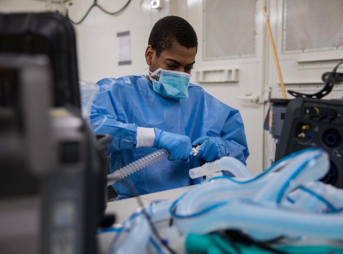 U.S. Army Specialist Fredrick Spencer assembles a T1 Hamilton ventilator in a mobile lab unit in the Javits New York Medical Station intensive care unit bay monitoring coronavirus disease (COVID-19) patients in New York City, U.S. April 4, 2020. U.S. Navy