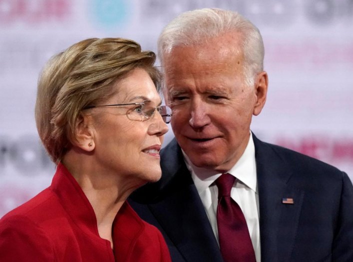 Democratic U.S. presidential candidates Senator Elizabeth Warren and former Vice President Joe Biden talk onstage before the start of the sixth Democratic presidential candidates campaign debate at Loyola Marymount University in Los Angeles, California, U