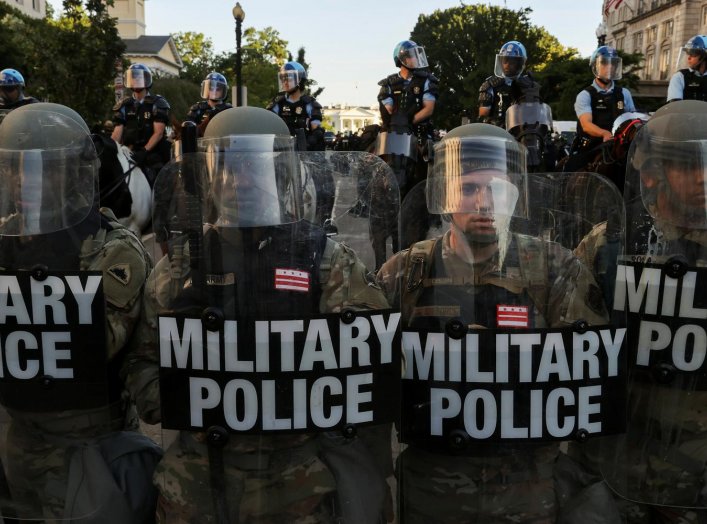 DC National Guard Military Police officers and law enforcement officers stand guard during a protests against the death in Minneapolis custody of George Floyd, near the White House in Washington, D.C., U.S., June 1, 2020. REUTERS/Jonathan Ernst