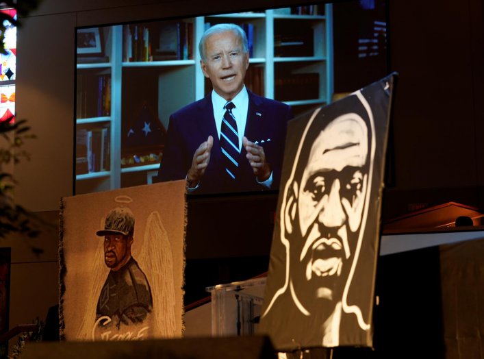 Democratic presidential candidate, former Vice President Joe Biden speaks via video link as family and guests attend the funeral service for George Floyd at The Fountain of Praise church Tuesday, June 9, 2020, in Houston. David J. Phillip/Pool via REUTERS