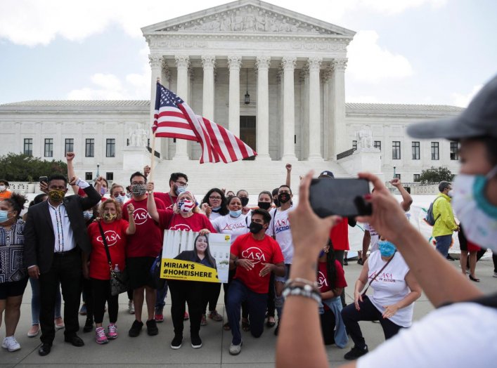 DACA recipients and their supporters celebrate outside the U.S. Supreme Court after the court ruled in a 5-4 vote that U.S. President Donald Trump's 2017 move to rescind the Deferred Action for Childhood Arrivals (DACA) program, created in 2012 by his Dem