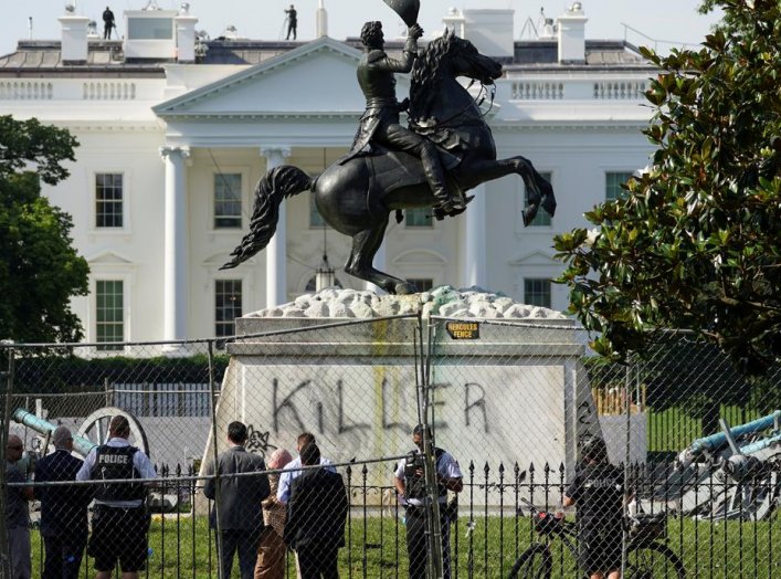 The word "Killer" is seen on the statue of U.S. President Andrew Jackson across from the White House a day after racial inequality protesters attempted to tear down the statue in Washington, D.C., U.S., June 23, 2020. REUTERS/Kevin Lamarque