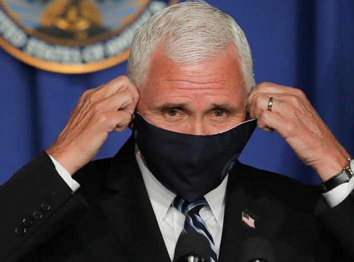 U.S. Vice President Mike Pence takes off his protective face mask to speak as he leads a White House coronavirus disease (COVID-19) task force briefing at the U.S. Education Department in Washington, U.S., July 8, 2020. REUTERS/Carlos Barria