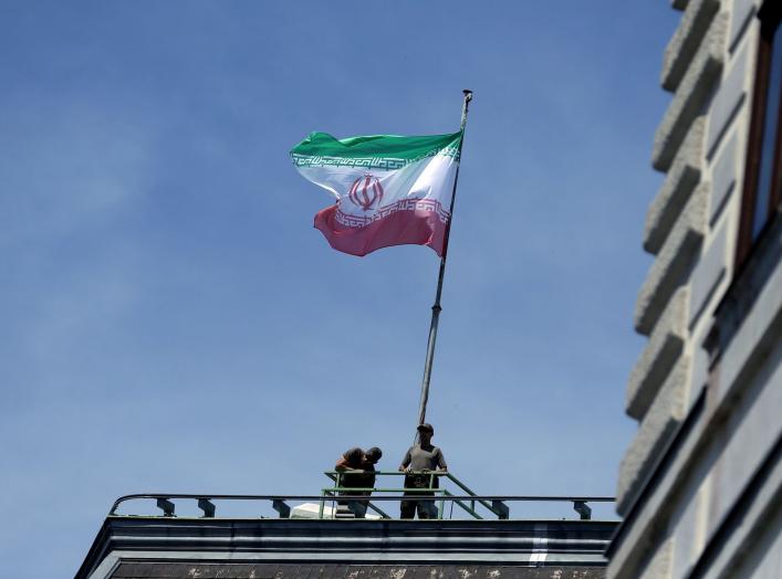 FILE PHOTO: The national flag of Iran is seen on top of the Austrian Chancellery during the visit of President Hassan Rouhani in Vienna, Austria July 4, 2018. REUTERS/Lisi Niesner/File Photo