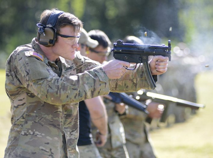 A student assigned to the U. S. Army John F. Kennedy Special Warfare Center and School who is in the Special Forces Weapons Sergeant Course fires an MP5K submachine gun during weapons training at Fort Bragg, North Carolina May 12, 2020. 