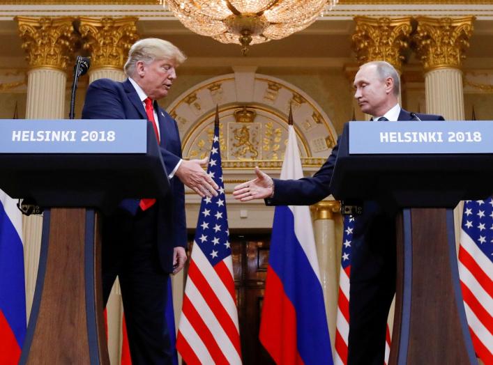 U.S. President Donald Trump and Russia's President Vladimir Putin shake hands during a joint news conference after their meeting in Helsinki, Finland, July 16, 2018. REUTERS/Kevin Lamarque