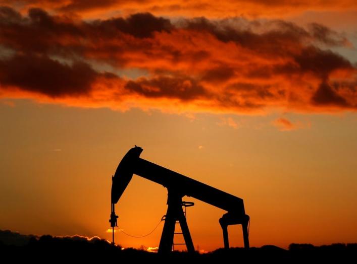 A oil pump is seen at sunset outside Scheibenhard, near Strasbourg, France, October 6, 2017 . REUTERS/Christian Hartmann