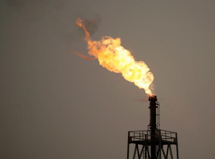 Flames rise from an oil refinery in Cairo, May 6, 2008. Egypt's parliament approved steep increases in fuel and cigarette prices and vehicle licence fees on Monday to cover the costs of public-sector pay hikes that President Hosni Mubarak proposed last we