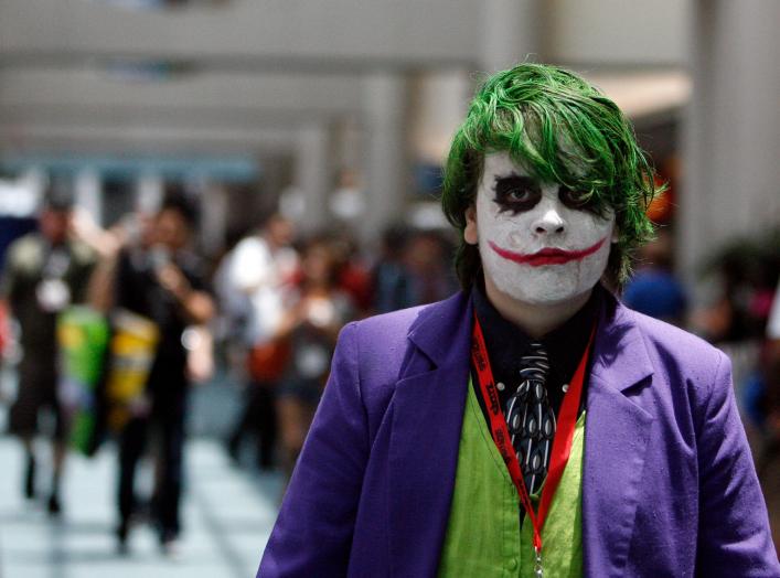 A visitor dressed like the Joker character from the movie "The Dark Knight" walks during the 40th annual Comic Con Convention in San Diego July 23, 2009. The convention runs July 23-26. REUTERS/Mario Anzuoni