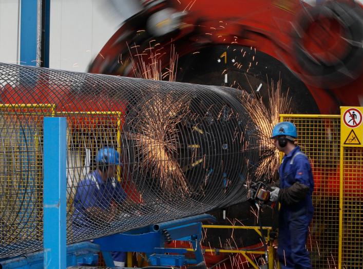 Worker at a welding machine prepare a steel cage for the concrete cover of the pipes for theNord Stream pipeline at a storage facility in Mukran on the Baltic sea island of Ruegen April 8, 2010. Nord Stream will have two pipelines, each with a capacity of