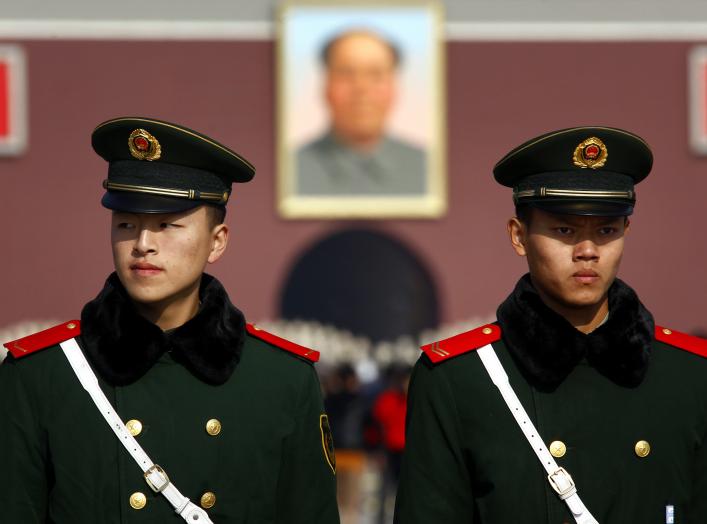 Paramilitary policemen stand guard on Beijing's Tiananmen Square November 6, 2012 as security is tightened around the square and the adjoining Great Hall of the People. Just days before the party's all-important congress opens, China's stability-obsessed 