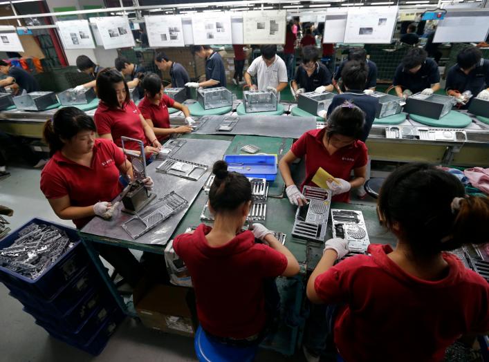 Employees work at a Foxconn factory in Wuhan, Hubei province, in this August 31, 2012 picture. REUTERS/Stringer (CHINA)