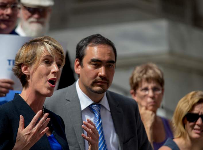 New York State democratic governor candidate Zephyr Teachout (L) speaks next to lieutenant governor candidate running mate Tim Wu (2nd L) during a campaign event in New York September 3, 2014.