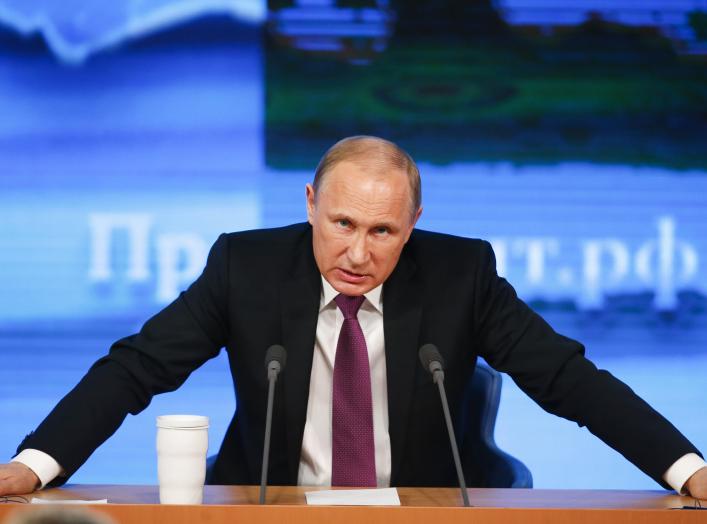 Russian President Vladimir Putin speaks during his annual end-of-year news conference in Moscow, December 18, 2014. The rouble edged lower against the dollar on Thursday, with traders saying President Vladimir Putin had offered few concrete measures at hi