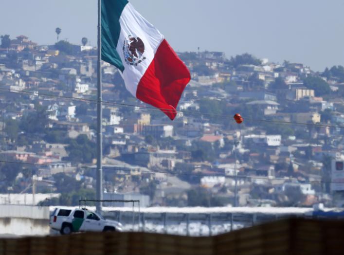 A U.S. border patrol officer sits in his vehicle looking out over Tijuana, Mexico from San Ysidro, California February 25, 2015. U.S. Senate leaders took a tentative step on Tuesday that could avert a partial shutdown of the Department of Homeland Securit