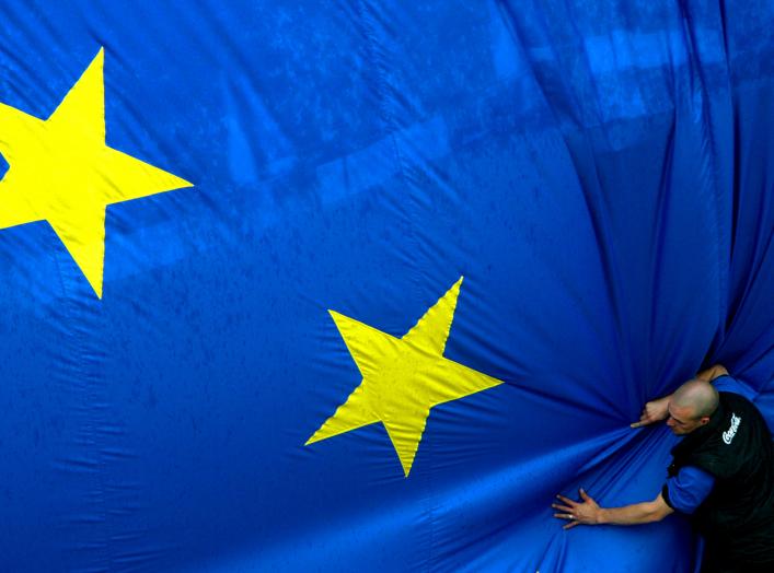 A worker adjusts a 150 metre-square European flag during a celebration in Brussels' Jubilee Park to mark the expansion of the European Union to 25 from 15 states on April 30, 2004. Cyprus, the Czech Republic, Estonia, Hungary, Latvia, Lithuania, Malta, Po