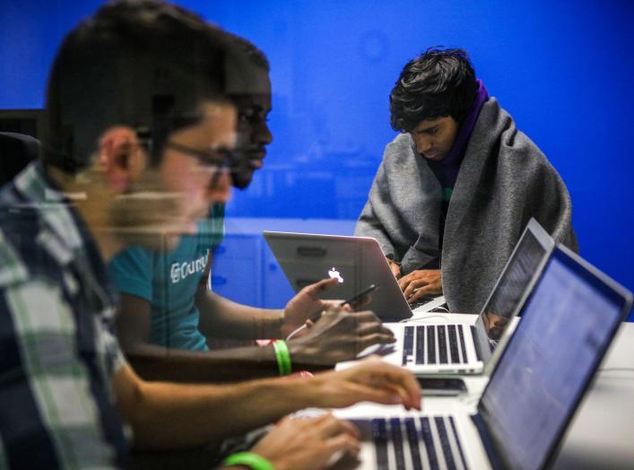 Mehmet Efe Akengin, Hassan Kane and Surya Bhupatiraju (L-R) work late into the night on computers during a weekend Hackathon event, in San Francisco, California, U.S. July 17, 2016. REUTERS/Gabrielle Lurie SEARCH "LURIE TECH" FOR THIS STORY. SEARCH "WIDER