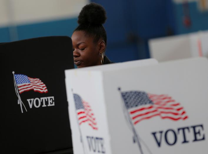 A voter casts her ballot on election day for the U.S. presidential election in Smithfield, North Carolina November 8, 2016. Picture taken November 8, 2016. REUTERS/Chris Keane