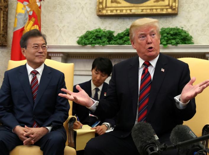 U.S. President Donald Trump gestures as he welcomes South Korea's President Moon Jae-In in the Oval Office of the White House in Washington, U.S., May 22, 2018. REUTERS/Kevin Lamarque