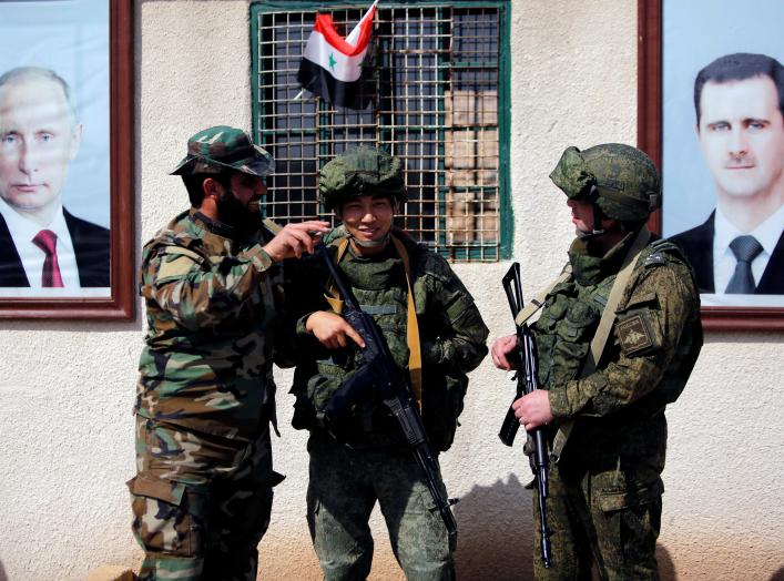 Syrian and Russian soldiers are seen at a checkpoint near Wafideen camp in Damascus, Syria March 2, 2018. REUTERS/Omar Sanadiki/File Photo