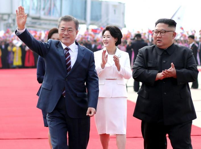 South Korean President Moon Jae-in and North Korean leader Kim Jong Un attend an official welcome ceremony at Pyongyang Sunan International Airport, in Pyongyang, North Korea, September 18, 2018. Pyeongyang Press Corps/Pool via REUTERS