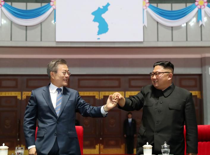 South Korean President Moon Jae-in and North Korean leader Kim Jong Un hold hands after watching the performance titled "the Glorious Country" at the May Day Stadium in Pyongyang, North Korea, September 19, 2018. Pyeongyang Press Corps/Pool via REUTERS