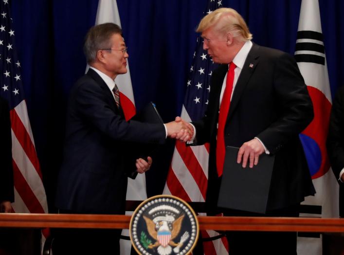 South Korean President Moon Jae-in shakes hands with U.S. President Donald Trump after they signed the U.S.-Korea Free Trade Agreement on the sidelines of the 73rd United Nations General Assembly in New York, U.S., September 24, 2018. REUTERS/Carlos Barri