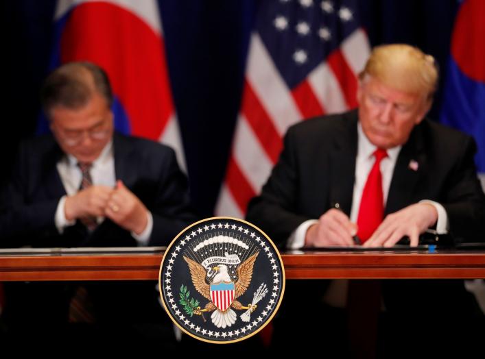 U.S. President Donald Trump and South Korean President Moon Jae-in sign the U.S.-Korea Free Trade Agreementon during a ceremony on the sidelines of the 73rd United Nations General Assembly in New York, U.S., September 24, 2018. REUTERS/Carlos Barria