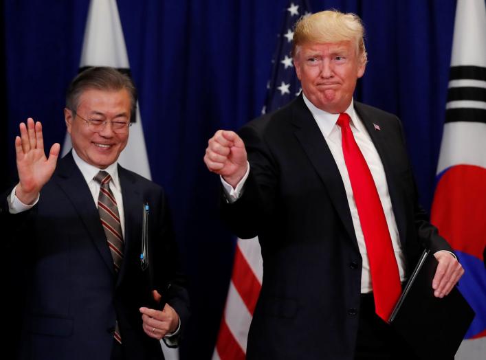 U.S. President Donald Trump and South Korean President Moon Jae-in gesture after signing the U.S.-Korea Free Trade Agreementon during a ceremony on the sidelines of the 73rd United Nations General Assembly in New York, U.S., September 24, 2018. REUTERS/Ca