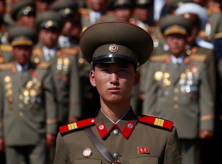 A soldier wears a badge with portraits of late North Korean leaders Kim Il Sung and Kim Jong Il as he attends a military parade marking the 70th anniversary of North Korea's foundation in Pyongyang, North Korea, September 9, 2018. REUTERS/Danish Siddiqui 