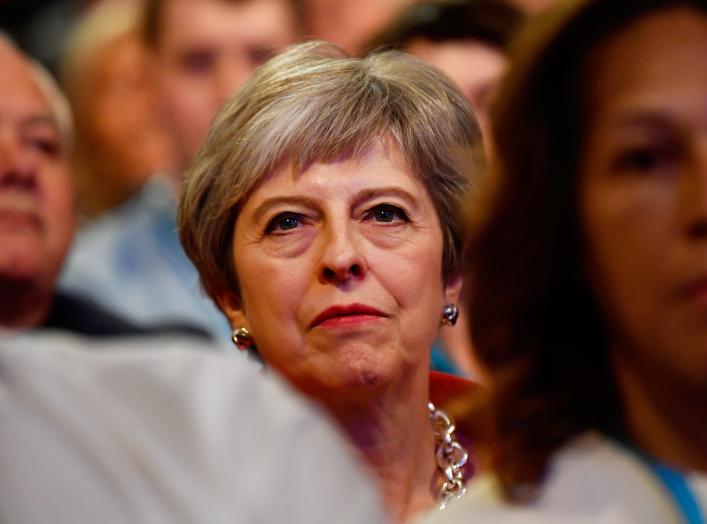 Britain's Prime Minister Theresa May sits in the audience at the start of the Conservative Party Conference in Birmingham, Britain September 30, 2018. REUTERS/Toby Melville