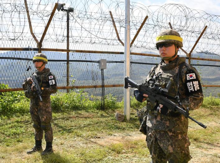 South Korean soldiers stand guard while removing landmines inside of the Demilitarized Zone (DMZ) on October 2, 2018 in Cheorwon, South Korea. Picture taken October 2, 2018. Song Kyung-Seok/Pool via REUTERS