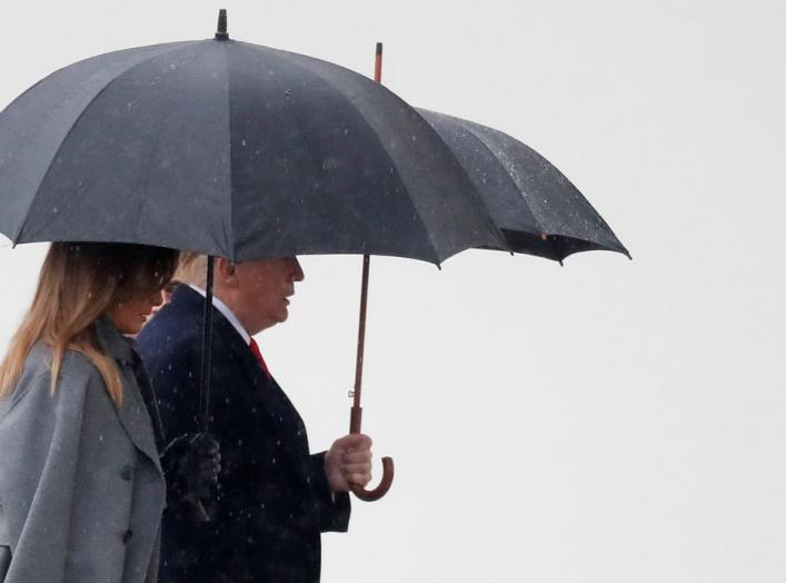 U.S. President Donald Trump and U.S. first lady Melania Trump attend a commemoration ceremony for Armistice Day, 100 years after the end of World War One, at the Arc de Triomphe, in Paris, France, November 11, 2018. REUTERS/Yves Herman