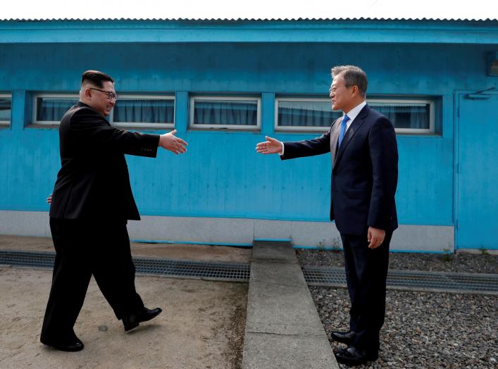 South Korean President Moon Jae-in and North Korean leader Kim Jong Un shake hands at the truce village of Panmunjom inside the demilitarized zone separating the two Koreas, South Korea, April 27, 2018. Korea Summit Press Pool/Pool via Reuters SEARCH "POY